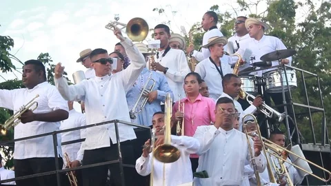 View of a tropical music orchestra on a float during a parade in Latin America Stock Footage 86771946
