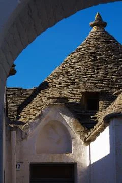 View of trullo through an arch Stock Photos