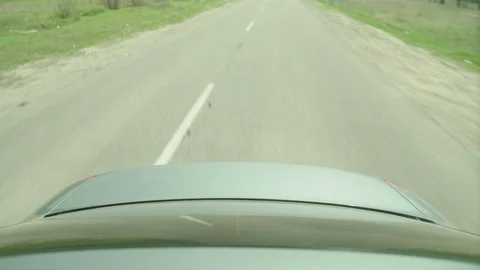 View of the trunk and on the road. The car dodges and turns sharply to the side. Stock Footage 107792291