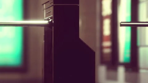 View of a turnstile with blurred background in a public place during the day Stock Footage 340028621