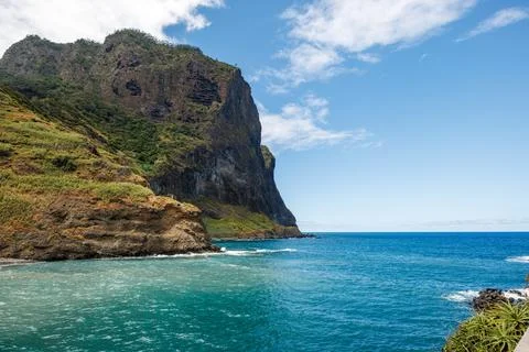 View of the turquoise waves of the Atlantic Ocean and huge cliffs in Porto .. Stock Photos