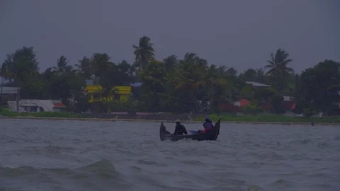 View of two men in a canoe with a lot of waves Stock Footage 106205631