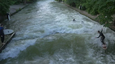 View of two men surfing in Munich Stock Footage 54265369