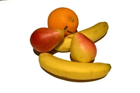 View of two pears two bananas and one orange on a white background  Fotos de archivo