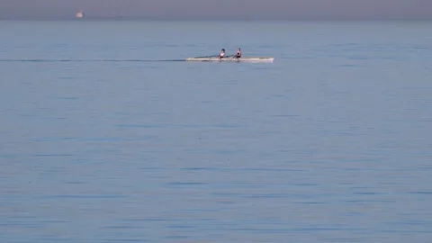 View of two people rowing a scull boat on the sea, Turkiye. Stock Footage 343878883