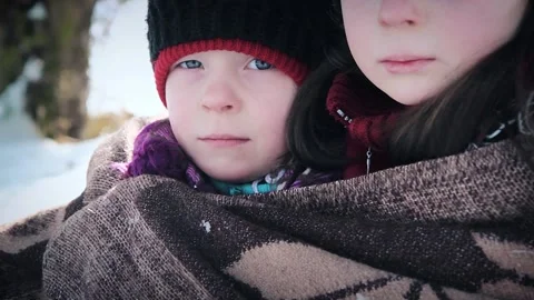 View of two poor hungry girls in winter Stock Footage 130229893