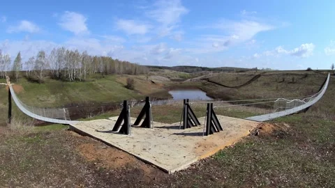 View of two rope bridges across a small river in the national park in spring Video stock 169522286