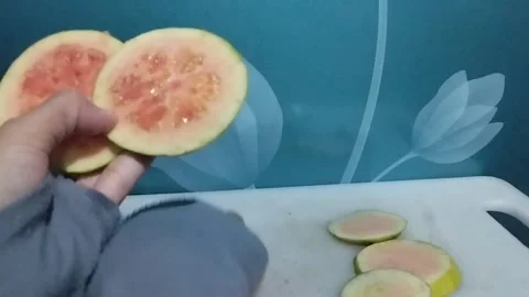 A view of two round slices of pink crystal pink is shown Stock Footage 229255029