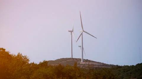 View of two windmills for renewable electric energy production Stock Photos