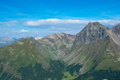 View into a typical trough valley in the Grisons mountains, Switzerland Stock Photos
