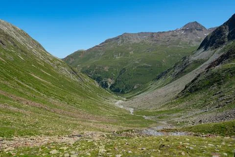 View into a typical trough valley in the Grisons mountains, Switzerland Stock Photos