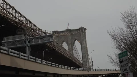 A view from under the Brooklyn Bridge in New York City Stock Footage 241498469