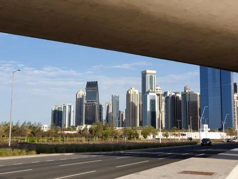 A view from under a concrete overpass looking toward the skyscrapers Stock Photos