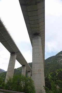 View from under Highest of huge pylons of reinforced concrete to support hi.. Stock Photos