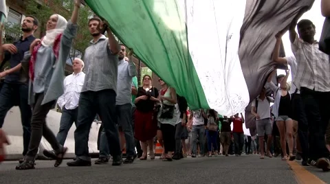 View under large Palestine flag during protest Stock Footage 41817767