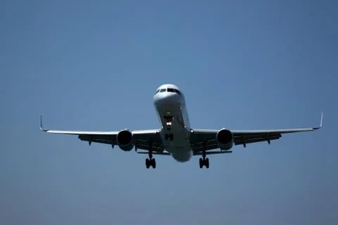 View of underside of an aeroplane as it lands Stock Photos