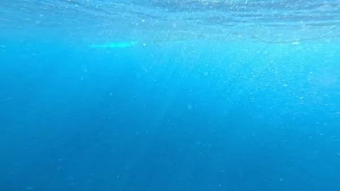 View from underwater breaking through ocean surface to open sea horizon. Stock Footage 331331716