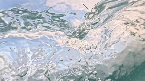 View from an underwater camera moving through the sea as bubbles and partic.. Stock Footage 316383031