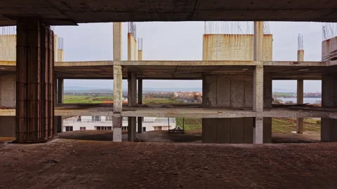 View of unfinished building with open structure in rural landscape Stock Footage 324519973