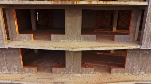 View of unfinished concrete building structure from above during daytime Stock Footage 324519910