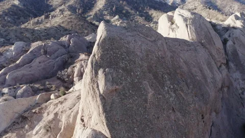 View of unique rock formations in the Devil's Punchbowl, jagged, tilted Stock Footage 284197415