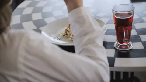 View of unrecognizable girl eats very nice dessert. 4K Video stock 88506042