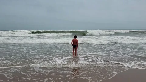 View of an unrecognizable kid in the beach Stock Footage 130739336