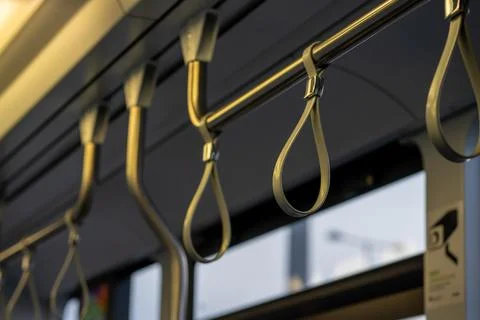 View of the upper handrail loops in public transport Stock Photos