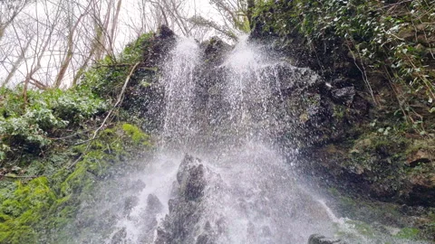 A view of the upper part of the waterfall with water cascading down. Stock Footage 264967080