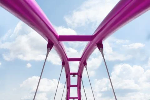 View of the upper structure of the fuchsia bridge against the blue sky. Stock Photos