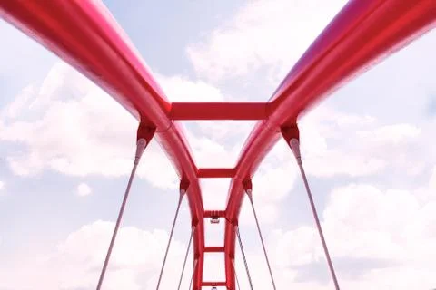 View of the upper structure of the red bridge against the blue sky. Stock Photos