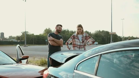 View of upset stressed drivers looking on broken stuck cars on the roadside. Two Stock Footage 112985612