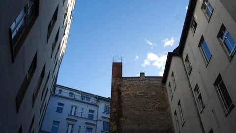 View urban patio with cloud passing Stock Footage 104818439