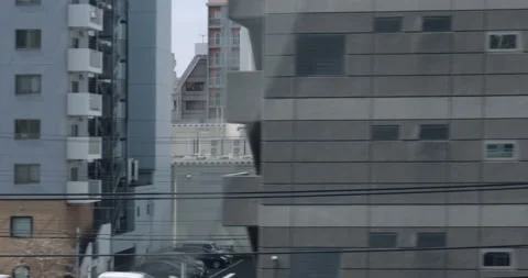 View of the urban Tokyo from train window. Train from Kyoto to Tokyo Video stock 133065855