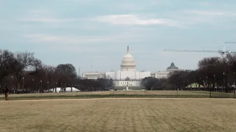 View of US Capitol Building from a park in Washington, DC Stock Footage 245753143