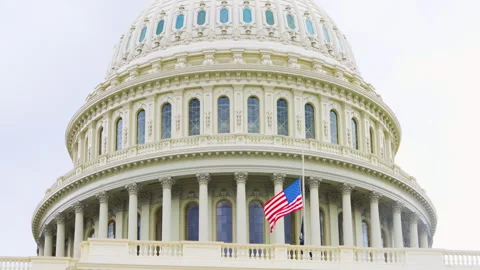 View of the U.S. Capitol showcases its grand dome, wide staircases, and neoclass Stock Footage 310873022
