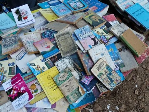 View of used and second hand books on a sidewalk bookseller's table in Yangon Stock Photos