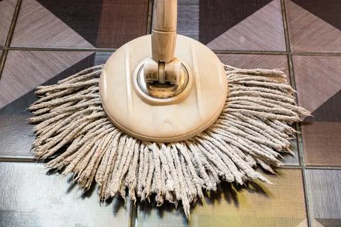 View of used round spin mop with micro fiber head. Stock Photos