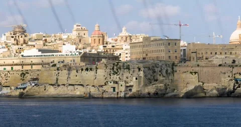 View of Valletta from the sea through a dirty cruise ship window Stock Footage 328609524