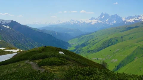 View the valley and distant mountains from the top of the Caucasus Mountains Stock Footage 314632654