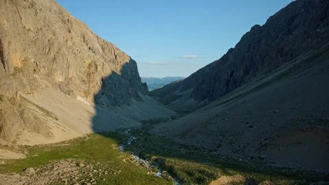 A view of a valley and stream in the Munzur Mountains. Stock Footage 246331056