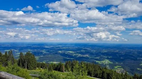 View to a valley with cloudy sky Stock Photos