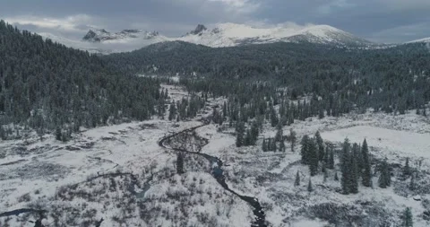 View of valley with trees and stream in mountains. Winter landscape Stock Footage 163519722