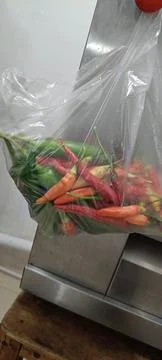 View of various chilies in clear plastic bags Stock-Fotos