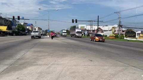 View of vehicles at traffic moving with speed on road sunny day, Thailand Stock Footage 248407678