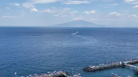 View of Vesuvius volcano and ferries from the observation deck in Sorrento Stock Footage 277475782