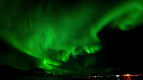 View of vibrant aurora borealis over the night sky in Norway. Video stock 342286804