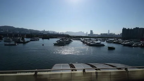 View of Victoria Harbour while riding on bus along Kwun Tong Bypass Part BC Stock Footage 226385563