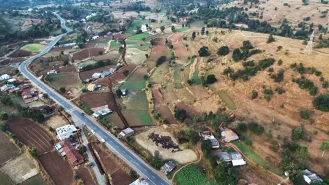 View of the village and road, highway road near village. fields in village Stock Footage 287751237