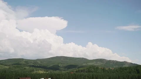 View of the village in the forest in front of the big mountains. Landscape. Blue Video stock 168049019